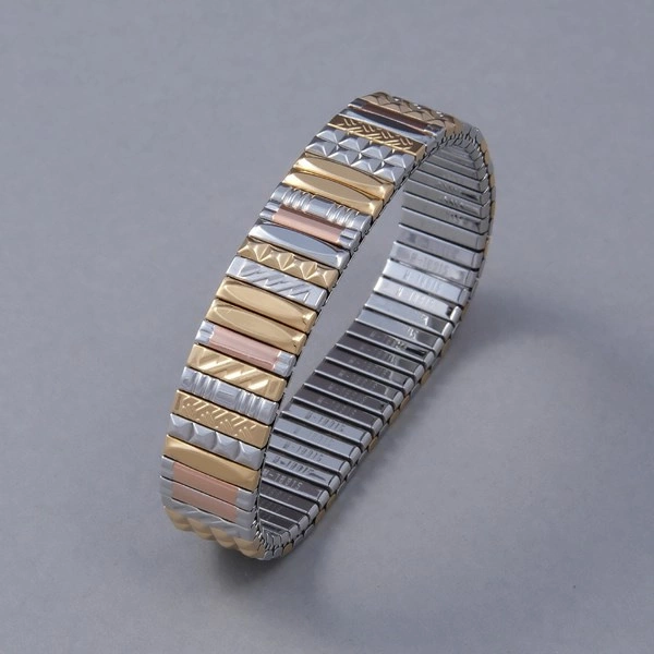 Bransoletka z inkrustowanych i pozłacanych ogniw ze stali. PHILHARMONIE