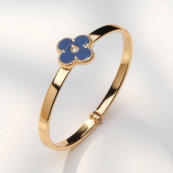 Złocona bransoletka z kwiatem w granacie z cyrkonią. GRANADA AL SOL