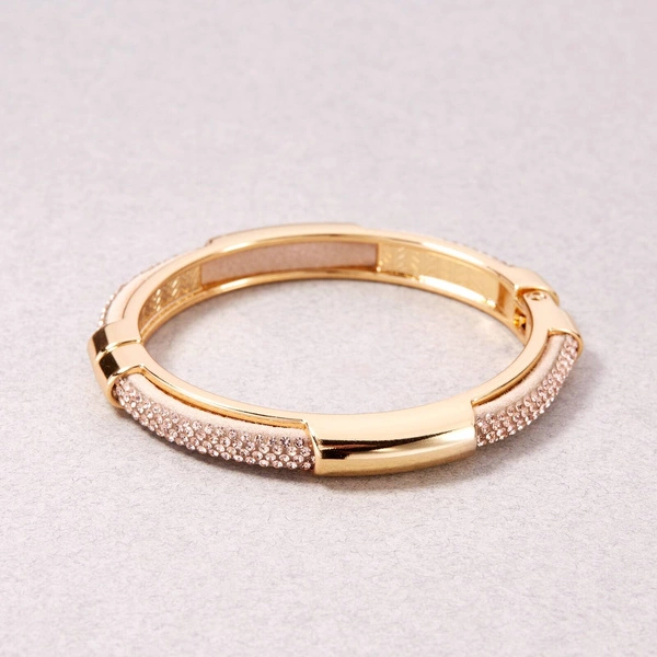 Sztywna złocona bransoletka z różówą połyskującą gumą. SZAMPAN