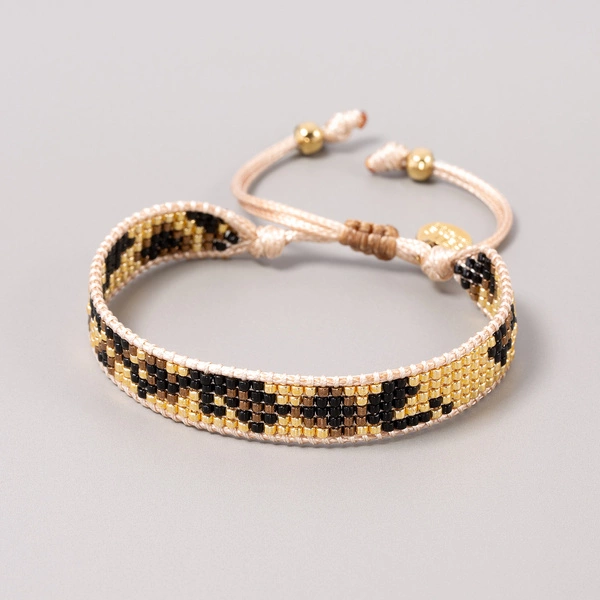 Wąska bransoletka w cętki pantery z paciorków Miyuki. LOUISE