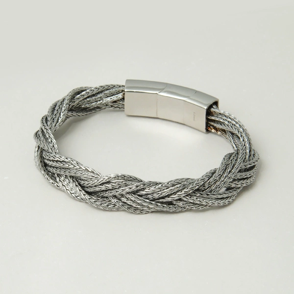 Bransoletka męska ze stalowych splecionych łańcuszków.  SUROWY BLASK