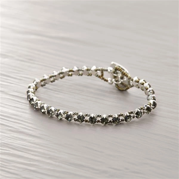 Posrebrzana bransoletka z szarych kryształków i koralików. NA MIŁY DZIEŃ