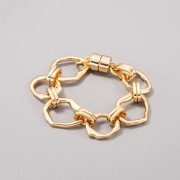 Pozłacana bransoletka z dużych nieregularnych ogniw. REVOLTA