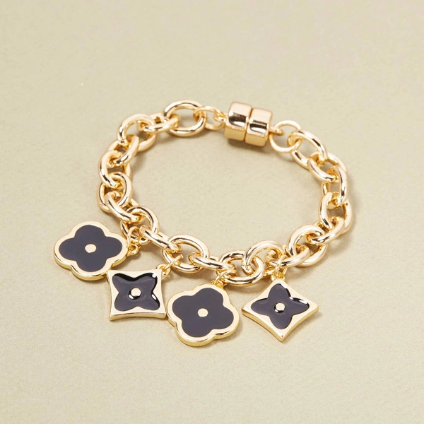 Złocona bransoletka z czarnymi kwiatkami na łańcuchu. LETNIA INSPIRACJA