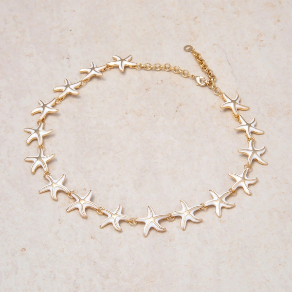 Krótki pozłacany naszyjnik z emaliowanymi rozgwiazdami. PODWODNE NIEBO