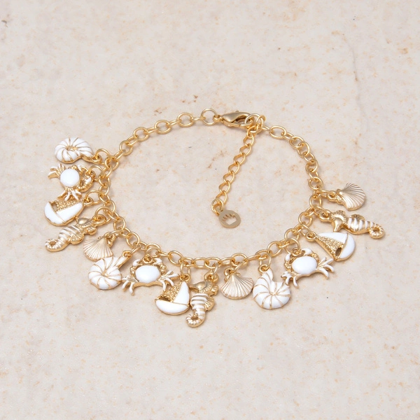 Pozłacana bransoletka zdobiona morskimi motywami. WODNY ŚWIAT