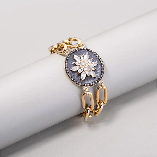 Pozłacana bransoletka z motywem kwiatka z cyrkonii. ŚRODEK LATA
