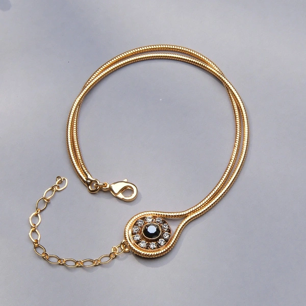 Złocona bransoletka na żmijce z oczkiem z czarnymi kryształami. CZERŃ I KLASYKA