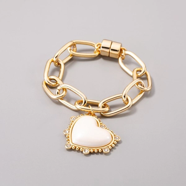 Pozłacany bransoletka z barokowym białym sercem. BIAŁE SERCE